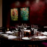 A table set up in a dining room at a hotel.